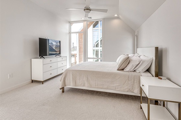 Secondary bedroom with floor to ceiling windows