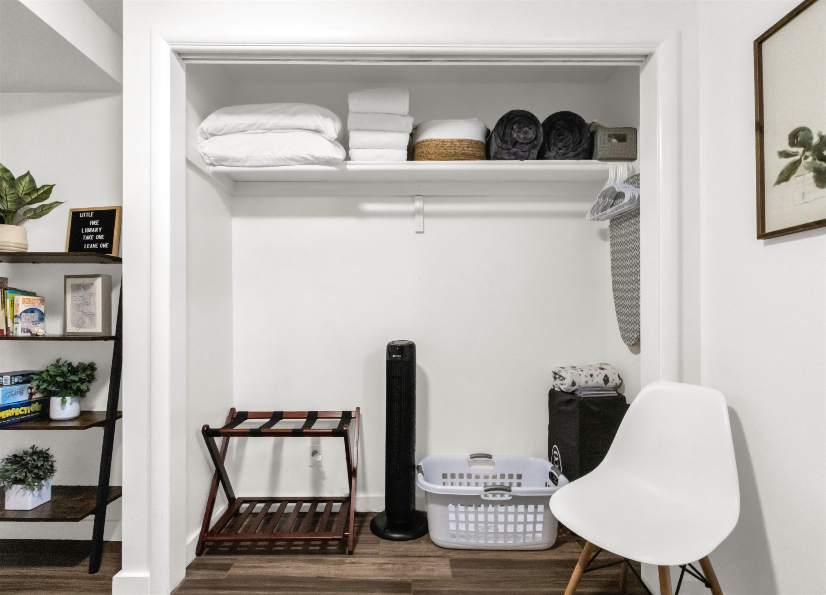 Closet in second bedroom showing extra pillows, blankets, towels and extra sheets. Pack and play (with sheets and blanket). Iron and iron board.