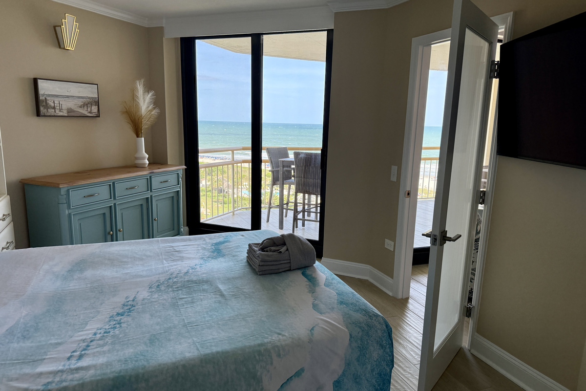 Ocean View Queen Guest Bedroom with Remote Controlled Shades