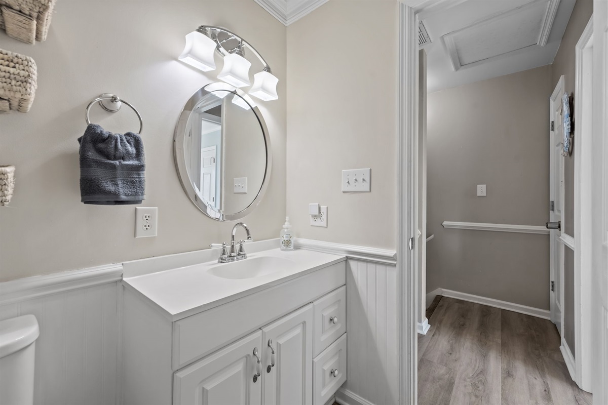 Vanity with storage and mirror in upstairs bathroom