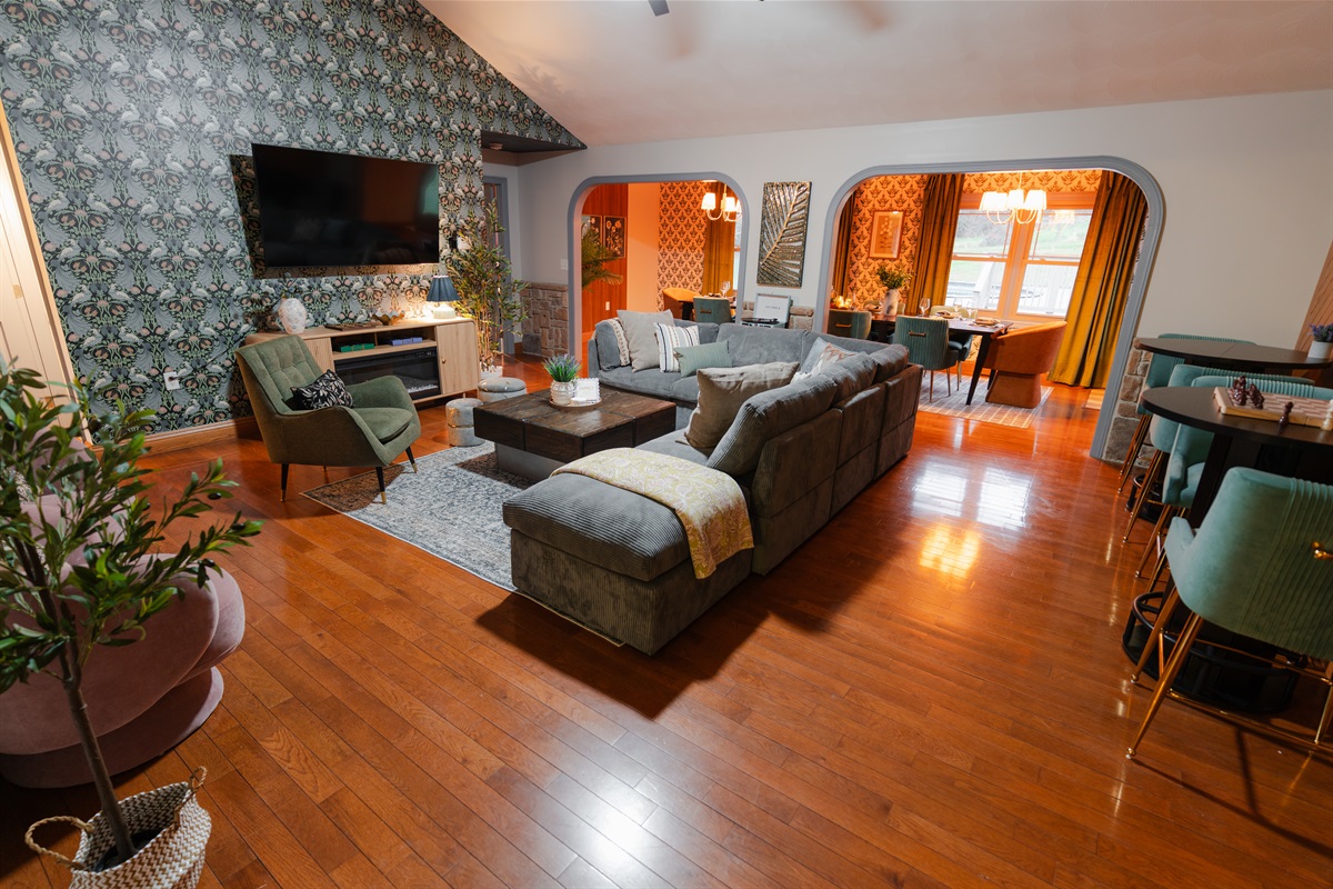 This large living room is set up for group hangouts, with plenty of seating and an open feel throughout.