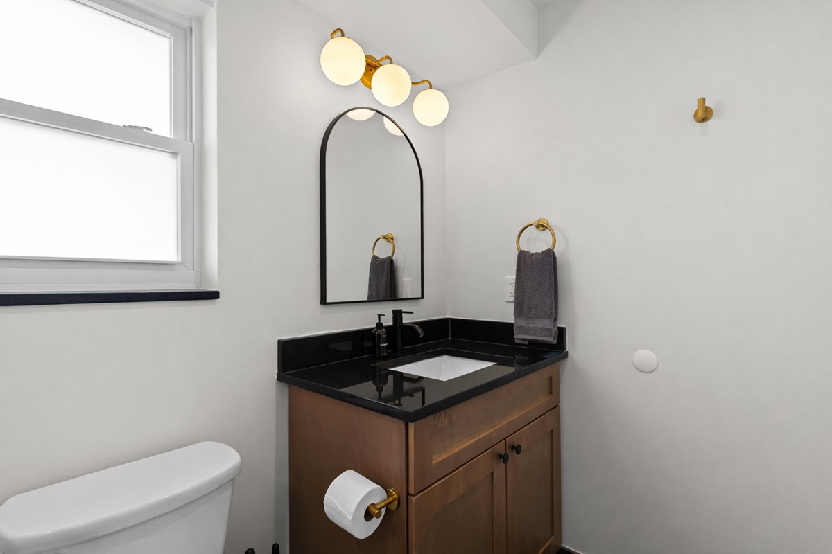 Modern vanity area with sleek fixtures, stylish lighting, and clean finishes—bright, functional, and thoughtfully designed for everyday use.