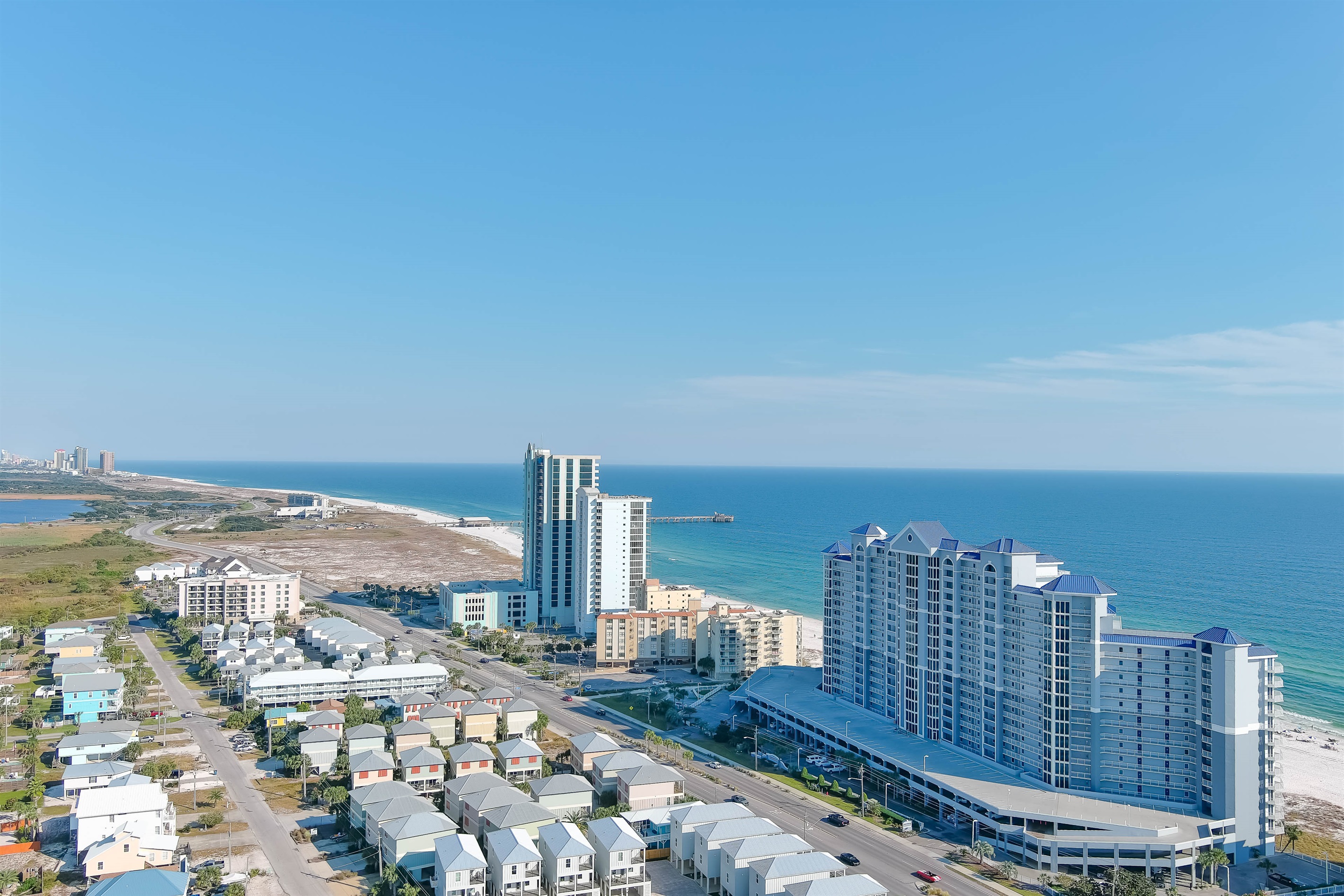 Aerial view of the Lighthouse Condos, showcasing our prime location near the best dining and entertainment in Gulf Shores.