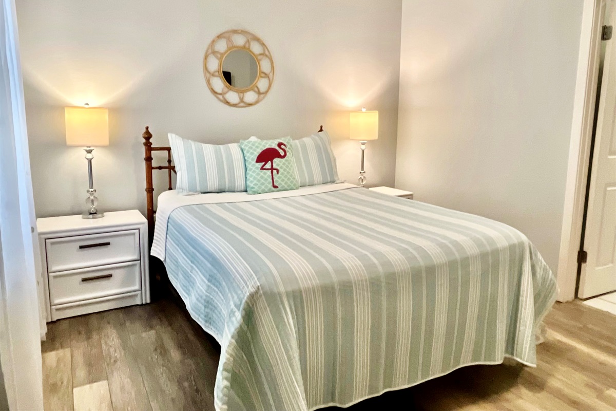 The second cozy guest bedroom features a queen bed!