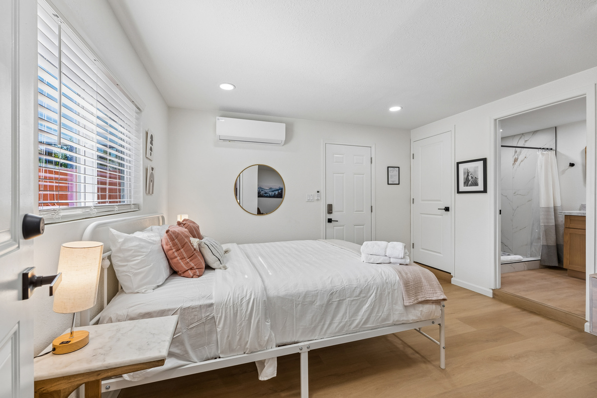 View of the Queen bed looking toward the main entrance.