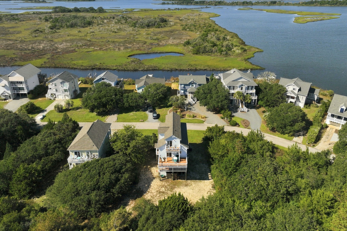 Stunning aerial views showcasing the surrounding coastal community, scenic marshlands, and waterways