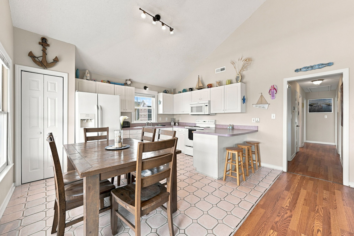 Prepare delicious meals with ease in the fully equipped kitchen featuring extra seating at the breakfast bar for casual bites or conversation