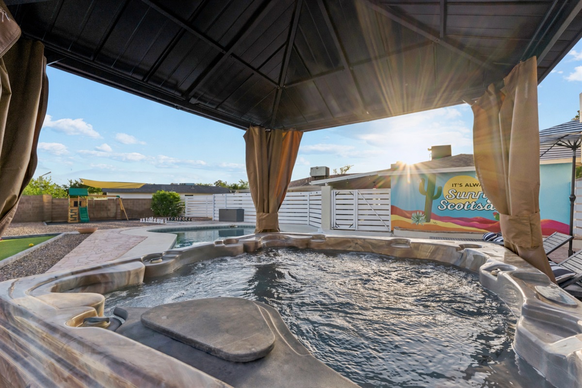 There's no better way to call it a day than to soak in this 5-person hot tub in this oasis yard shared with the other 3 apartments on this property.