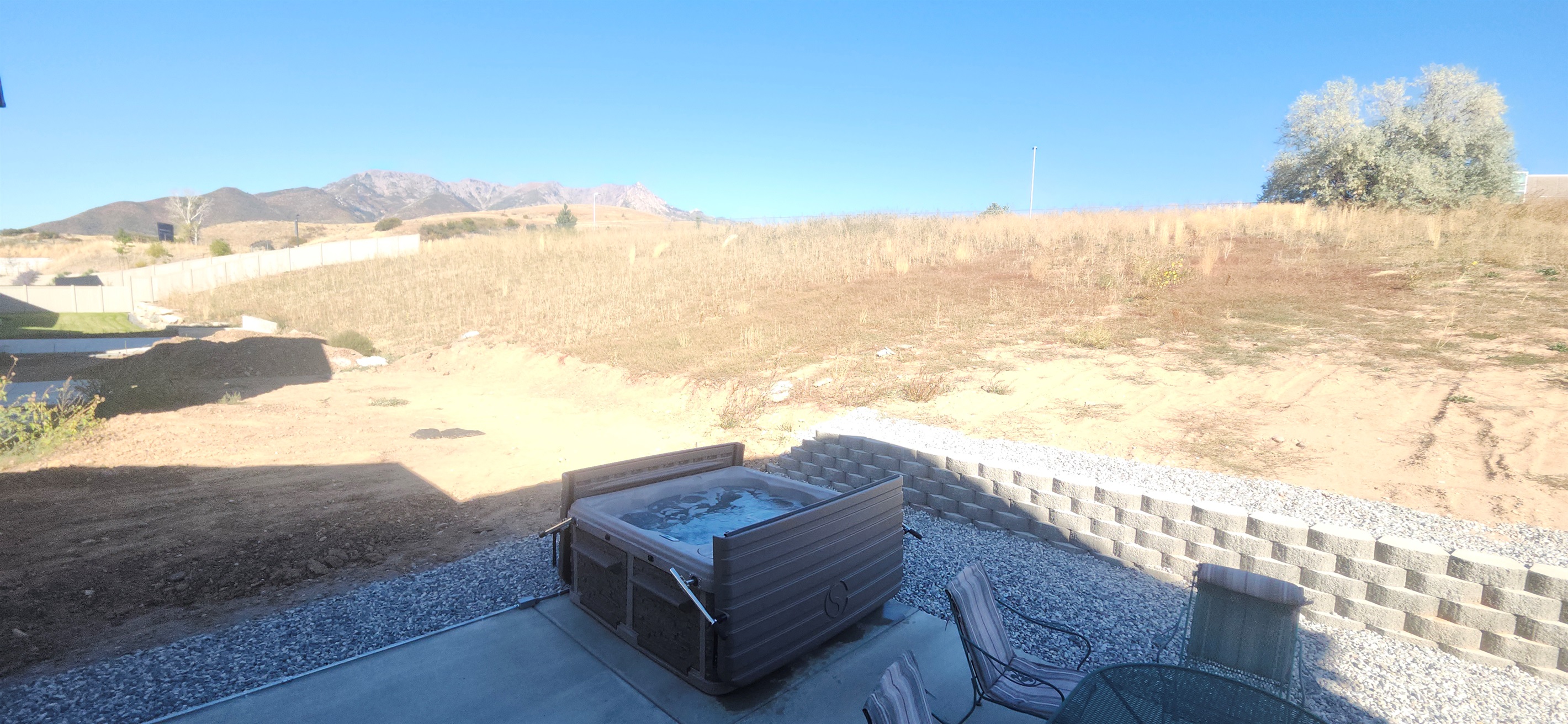 Gather with friends on the patio for mountain views, outdoor dining, and a soothing hot tub under the open sky.