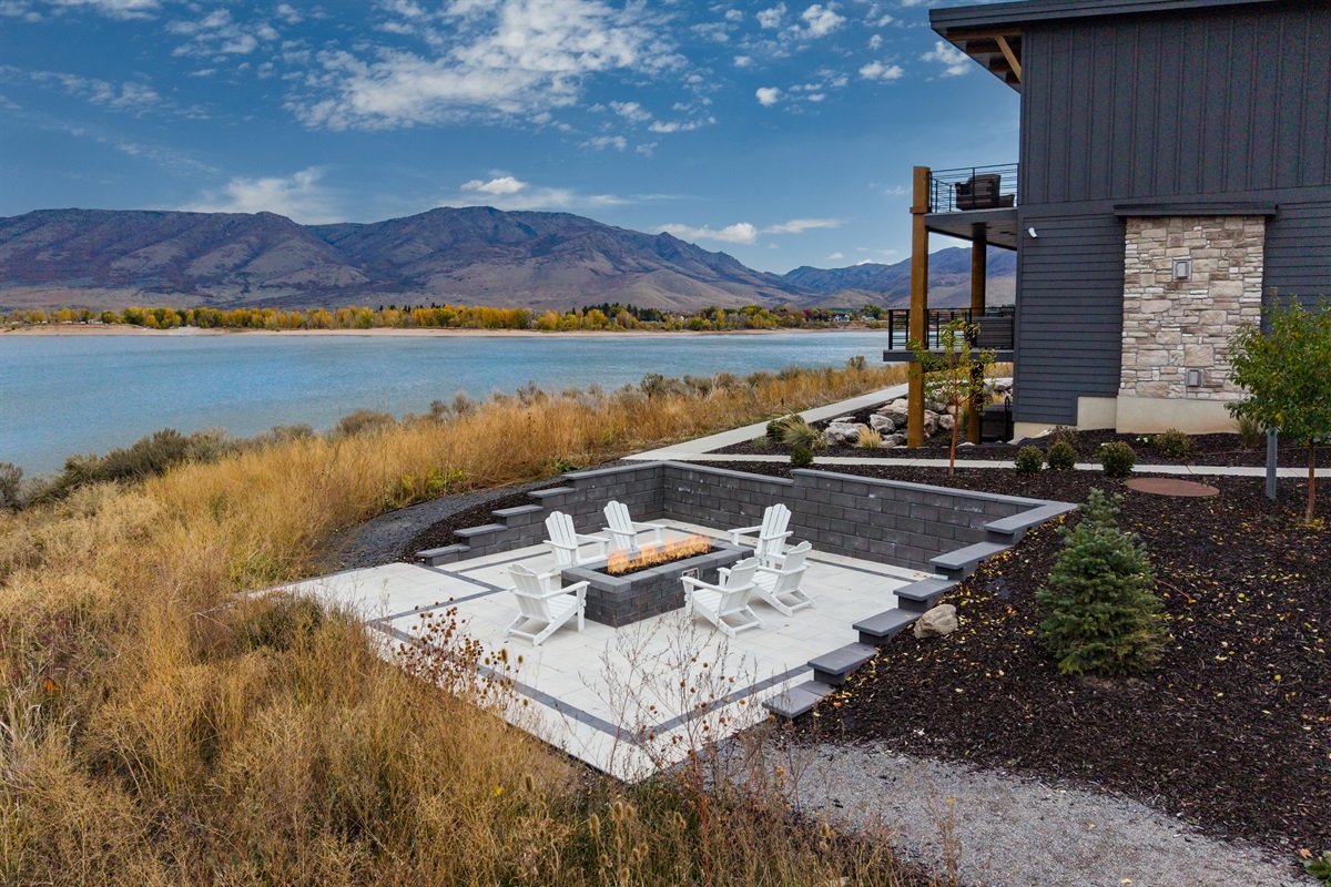 Lakeside community firepit with seating and panoramic views of Pineview Reservoir.
