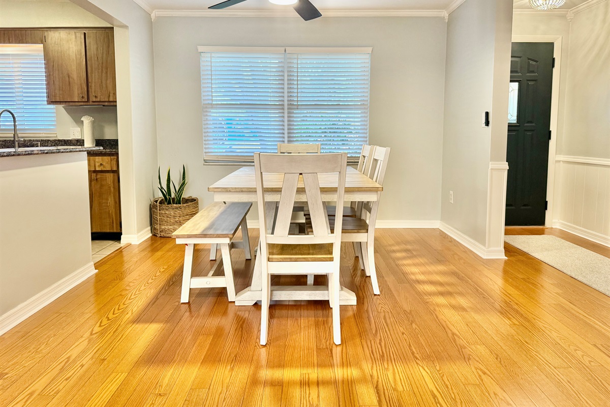 Cozy up to conversation in this light-filled dining area nestled between the living room and kitchen.