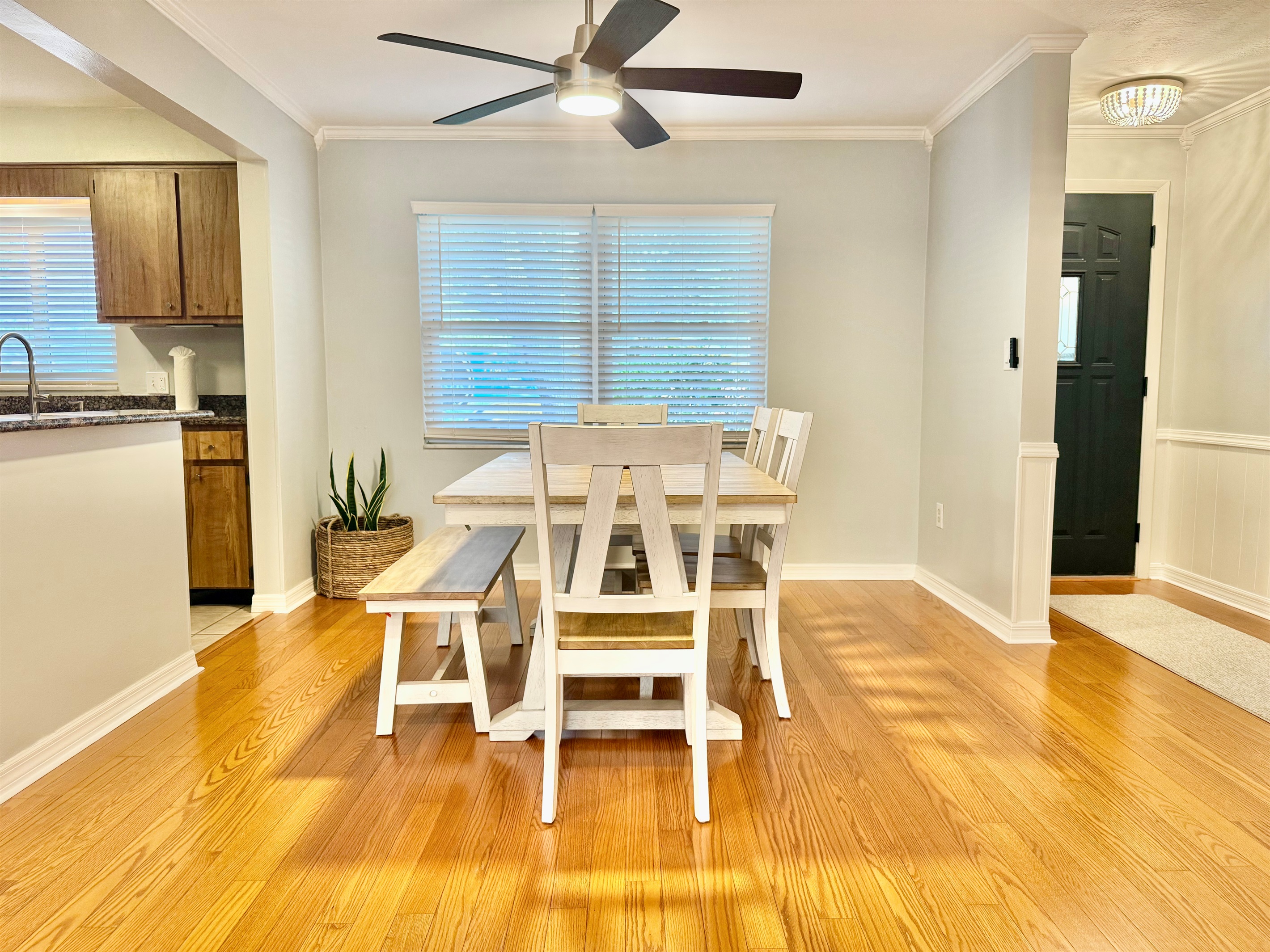Cozy up to conversation in this light-filled dining area nestled between the living room and kitchen.