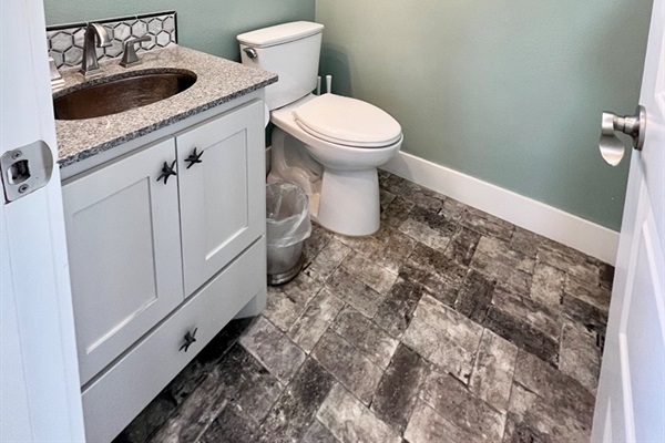 Crystal Paradise Bathroom 1: Guest-ready powder room combining style and practicality.