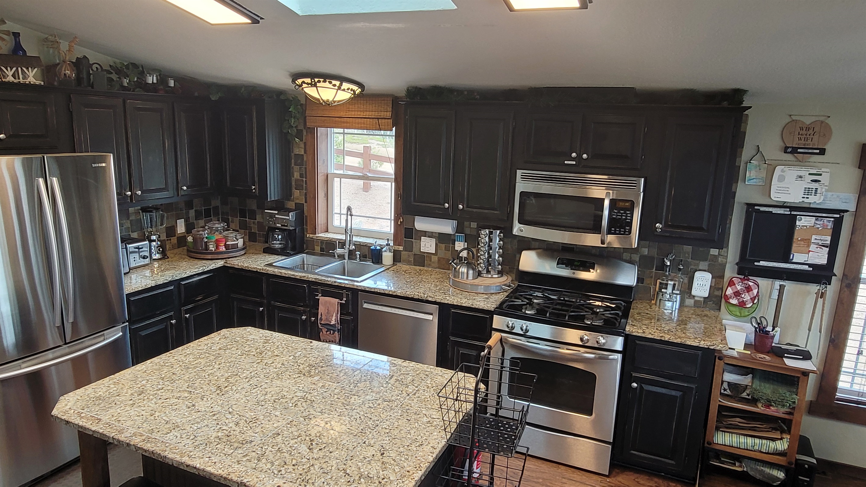 The Kitchen has high-end appliances: browning microwave, dishwasher,  gas stove & more.  It is stocked with cookware for any occasion, and an assortment of spices.
