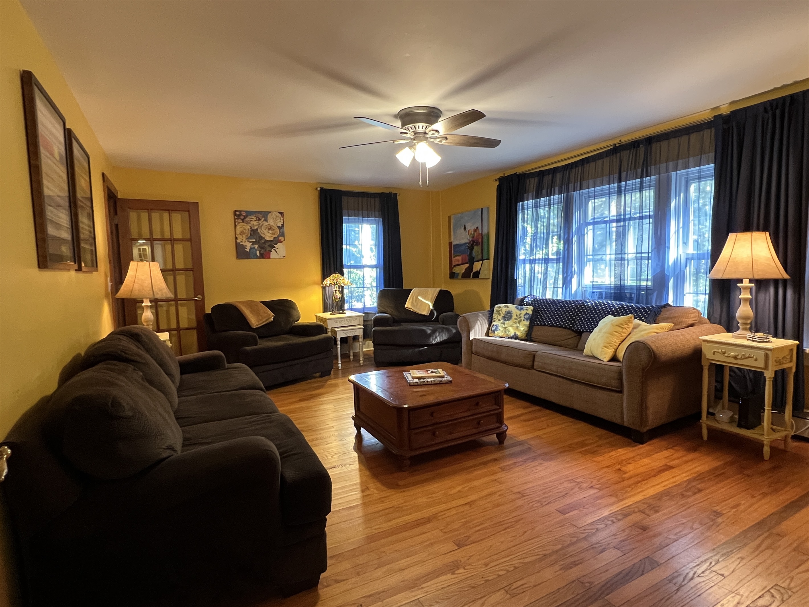 Dandelion main living room, lots of comfy seating and room for your group.