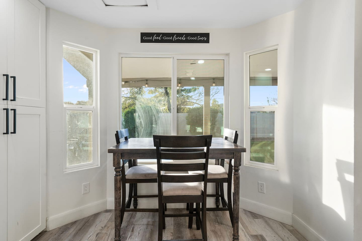 Bright dining area with expansive glass windows.