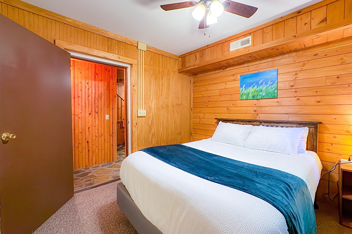 ol gun range cabin lower bedroom with an en-suite bathroom