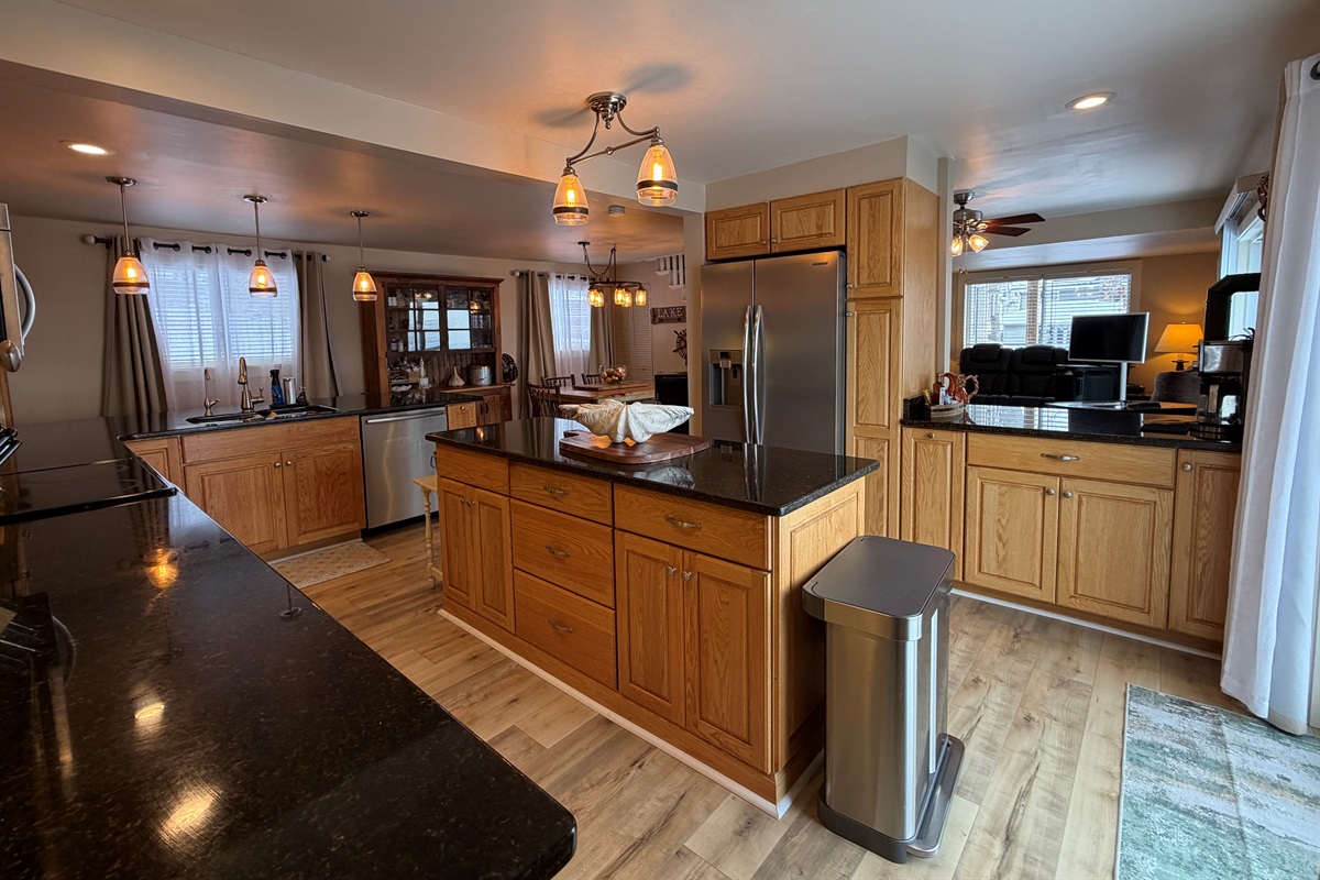 Kitchen with granite counter tops and large island
