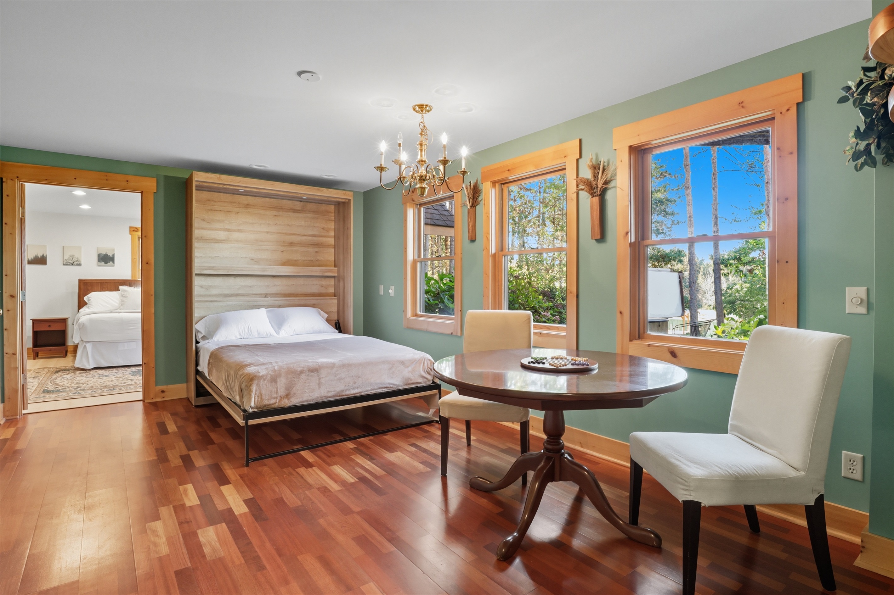 Spacious common space with queen Murphy bed, lower level