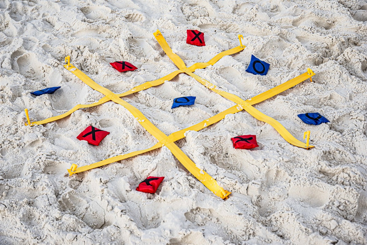 TicTacToe on the sand, wait those are my toes in the sand, drink in my hand!