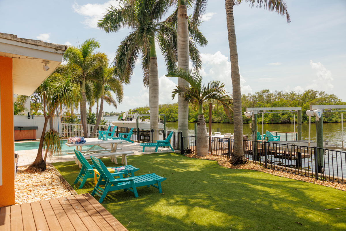 Relax in your private yard overlooking the water