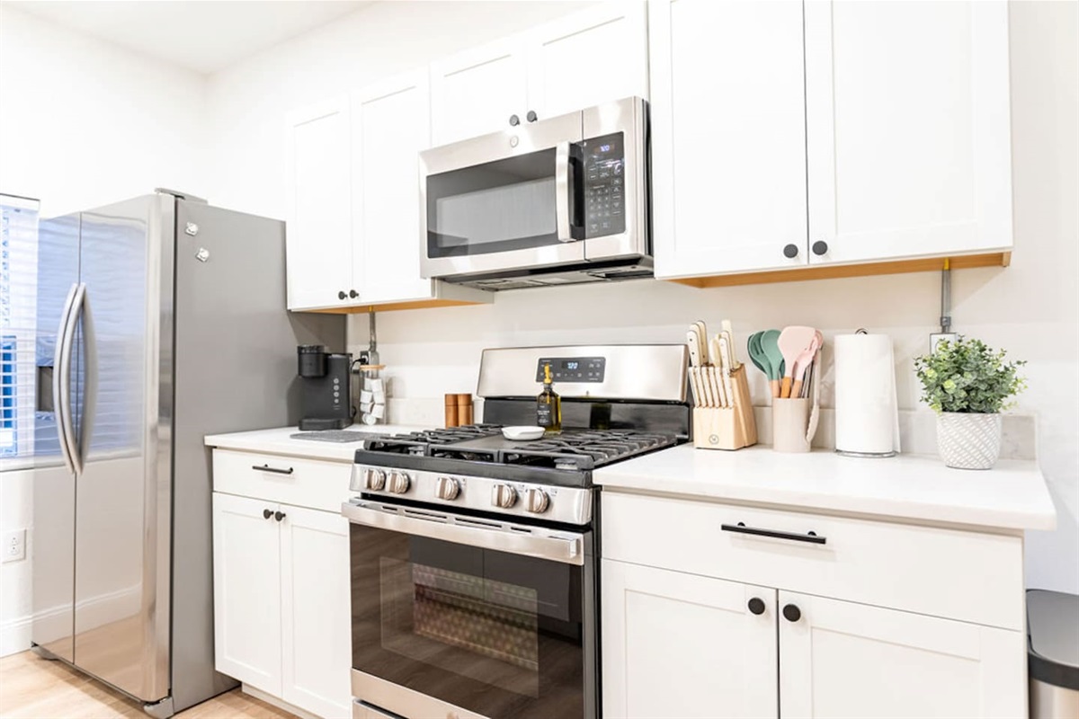 Fully stocked with essential kitchen wares, including cookware, utensils, and appliances for all your culinary needs.