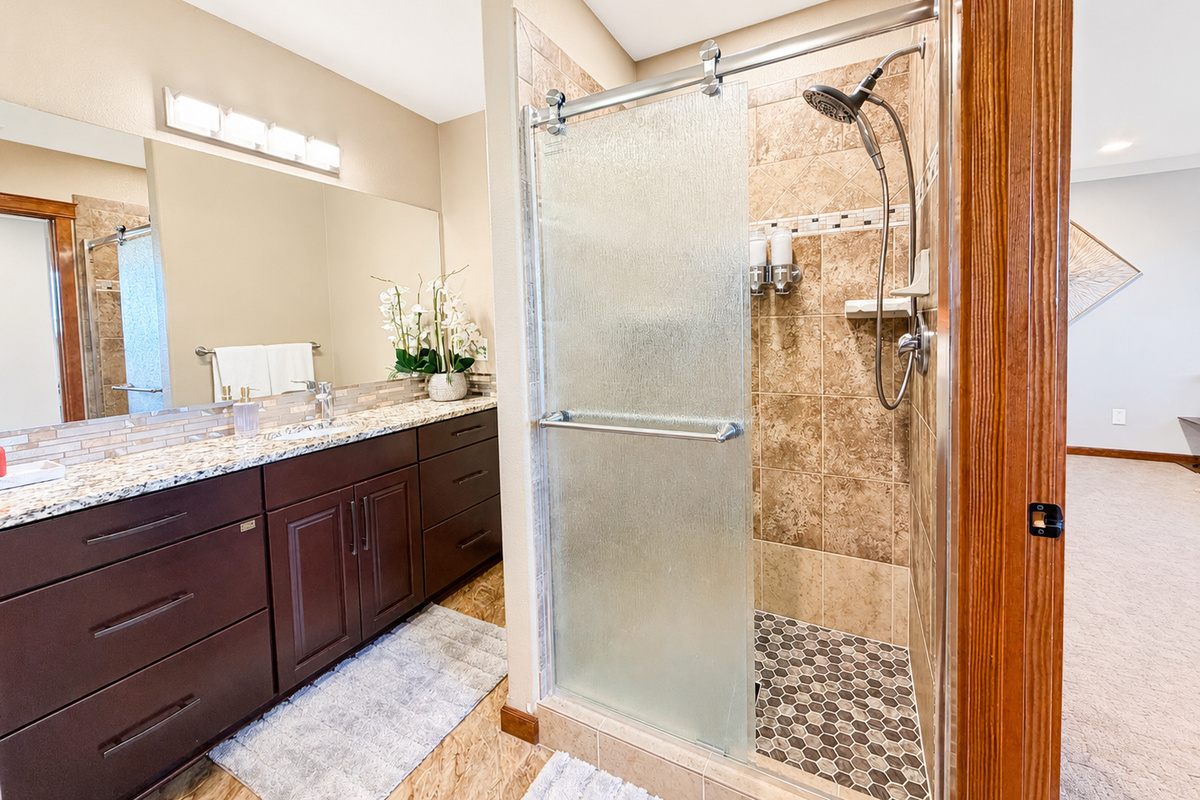 Experience the epitome of family-friendly luxury in our 2ndfloor bedroom. Enjoy the spacious comfort of a queen bed while the kids delight in their playful bunkbeds. With a walk-in closet for added convenience and an ensuite bathroom.