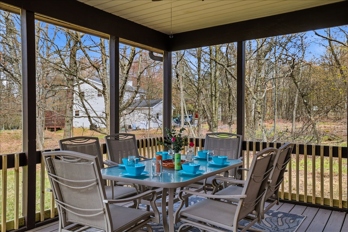 The screened-in porch was made for slow mornings and cozy evenings. Hammock naps, outdoor dining and fresh Pocono air included