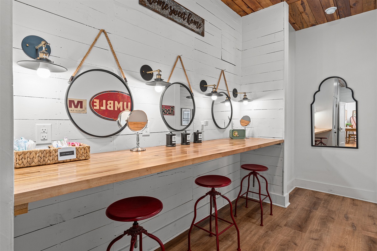 Get ready in style - this spacious vanity area features three mirrors and plenty of room for your group to get ready together. 