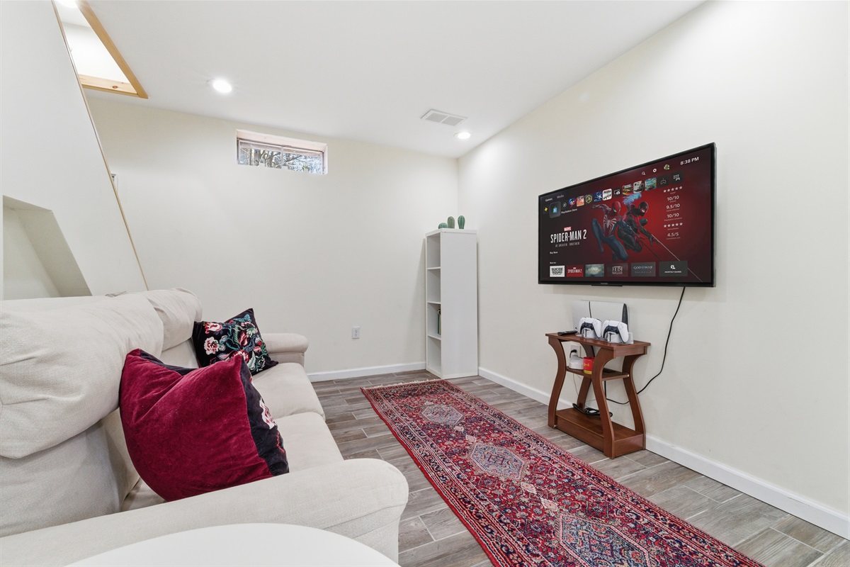 Lower level with Smart TV, PlayStation 5, foosball, mini pool table