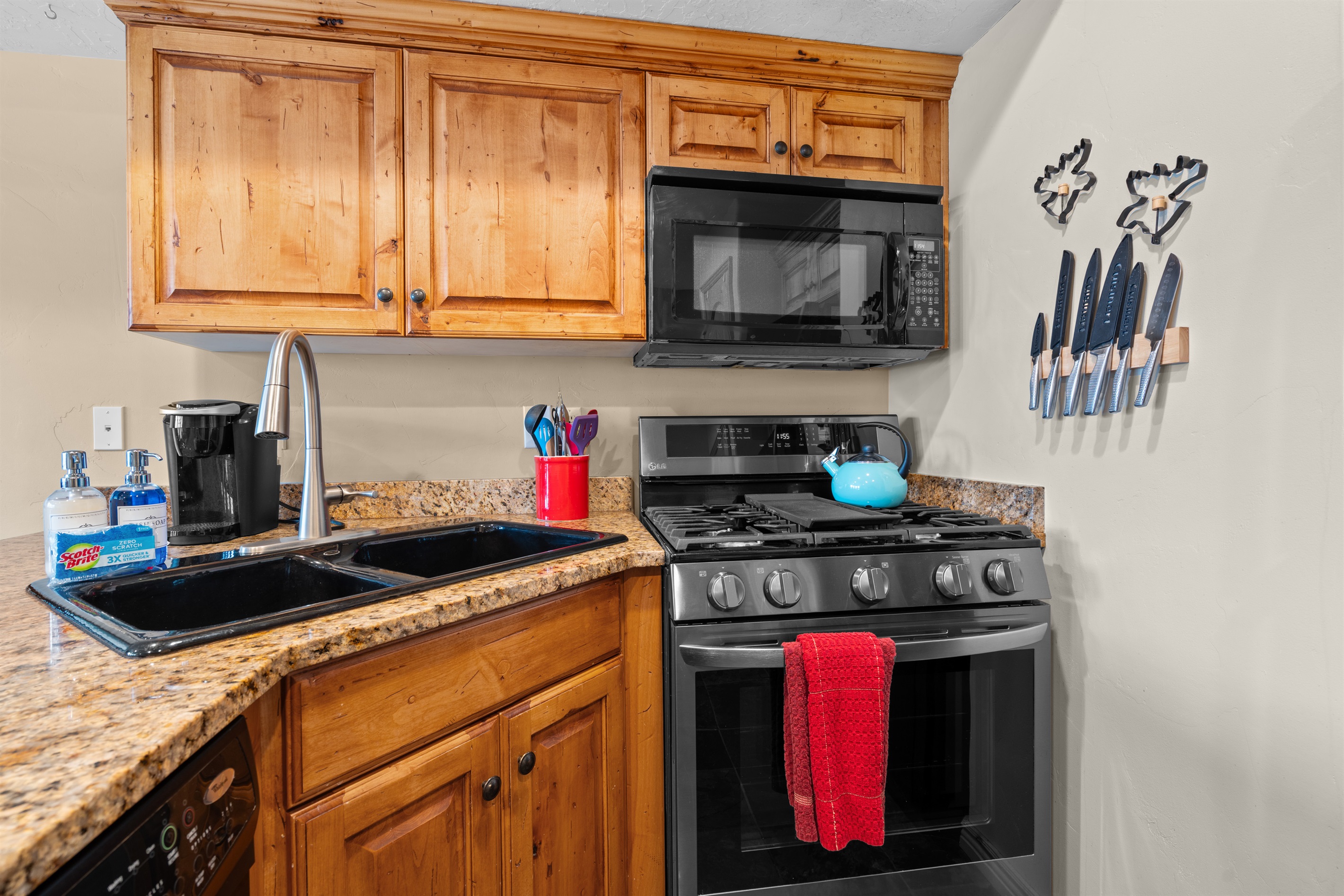 Fully equipped kitchen featuring a gas stove, microwave, and everything you need to cook at home.