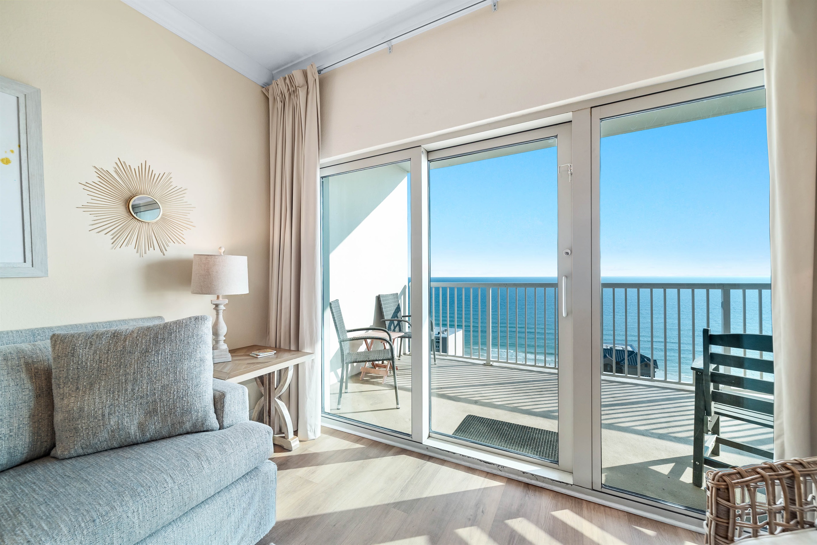 Experience the beauty of indoor-outdoor living with expansive sliding doors leading to a private balcony overlooking the ocean.