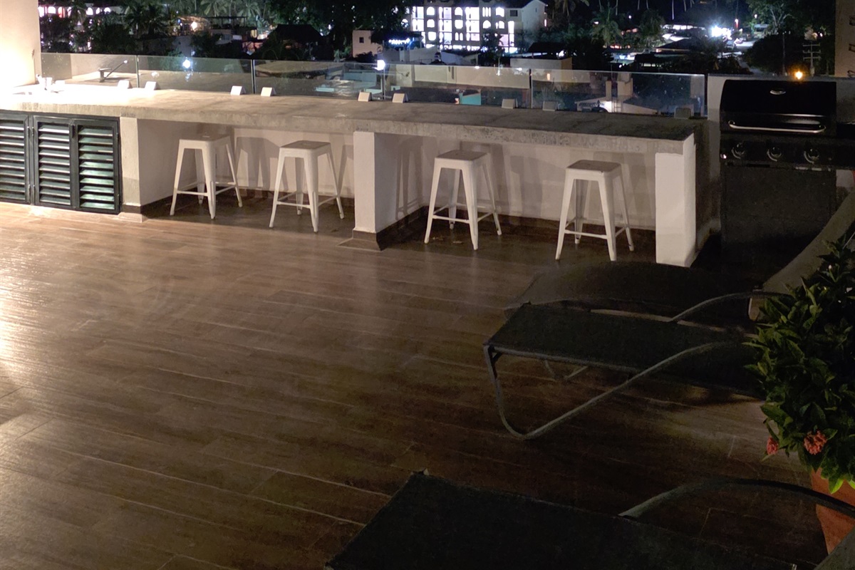 Roof top hang out with views of Banderas Bay and Puerto Vallarta on the left