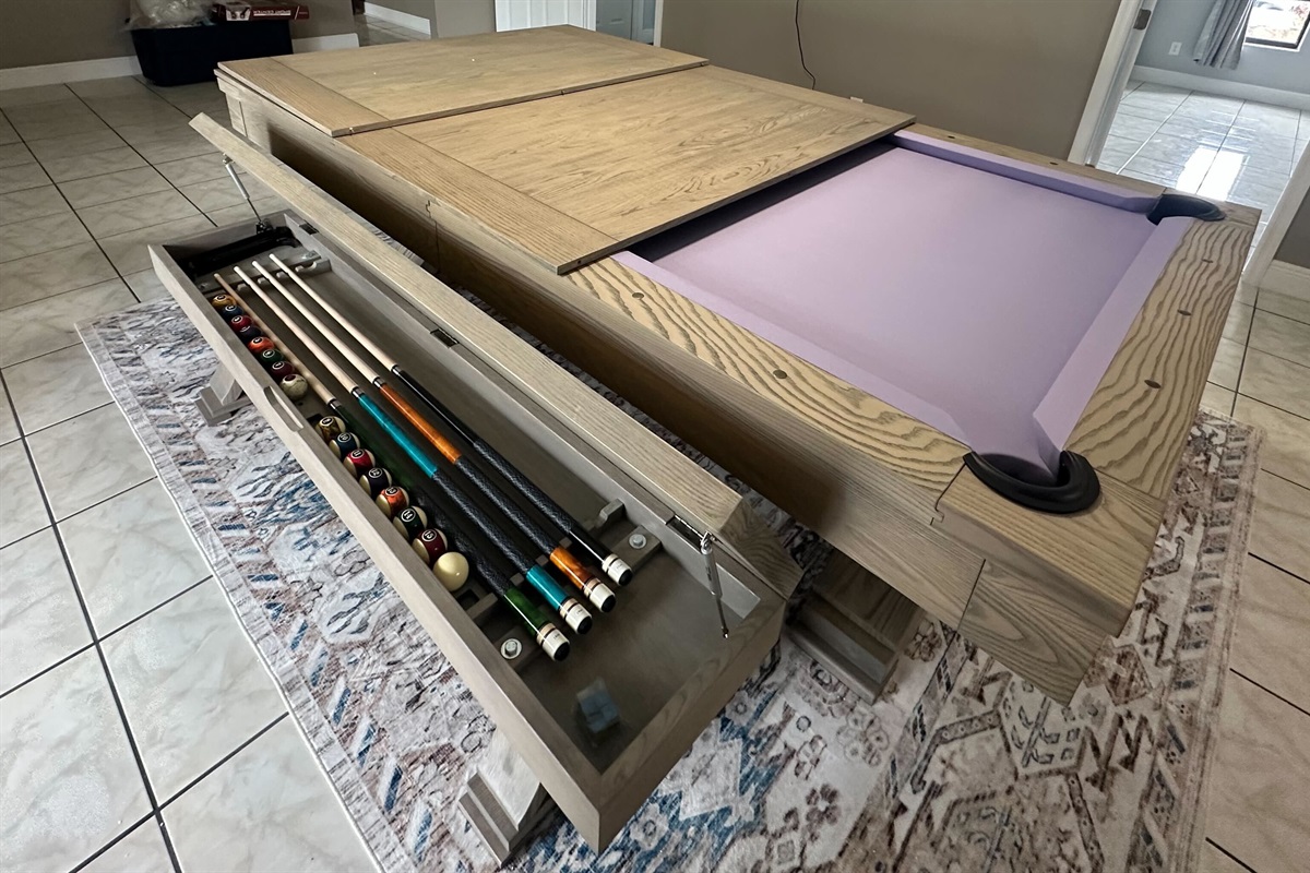 Hidden storage keeps cues and accessories neatly tucked away—perfect for family meals, game nights, and everything in between!