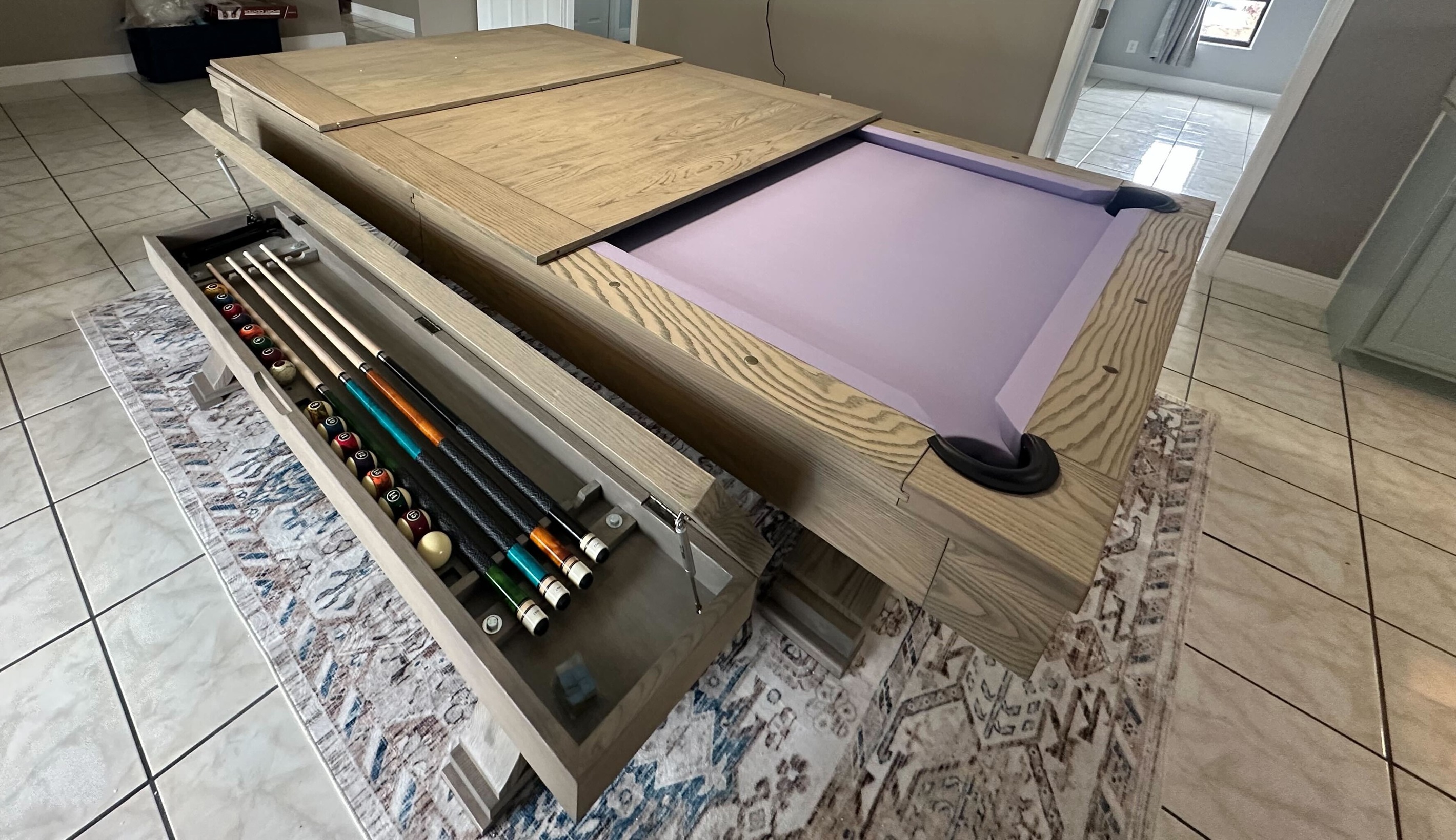 Hidden storage keeps cues and accessories neatly tucked away—perfect for family meals, game nights, and everything in between!