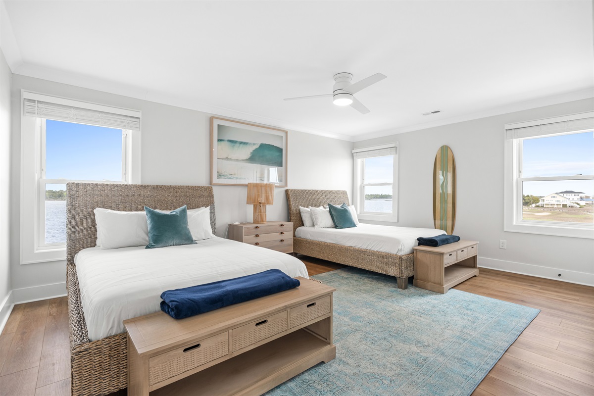 Spacious guest bedroom with two queen beds offers plenty of comfort for families or groups traveling together