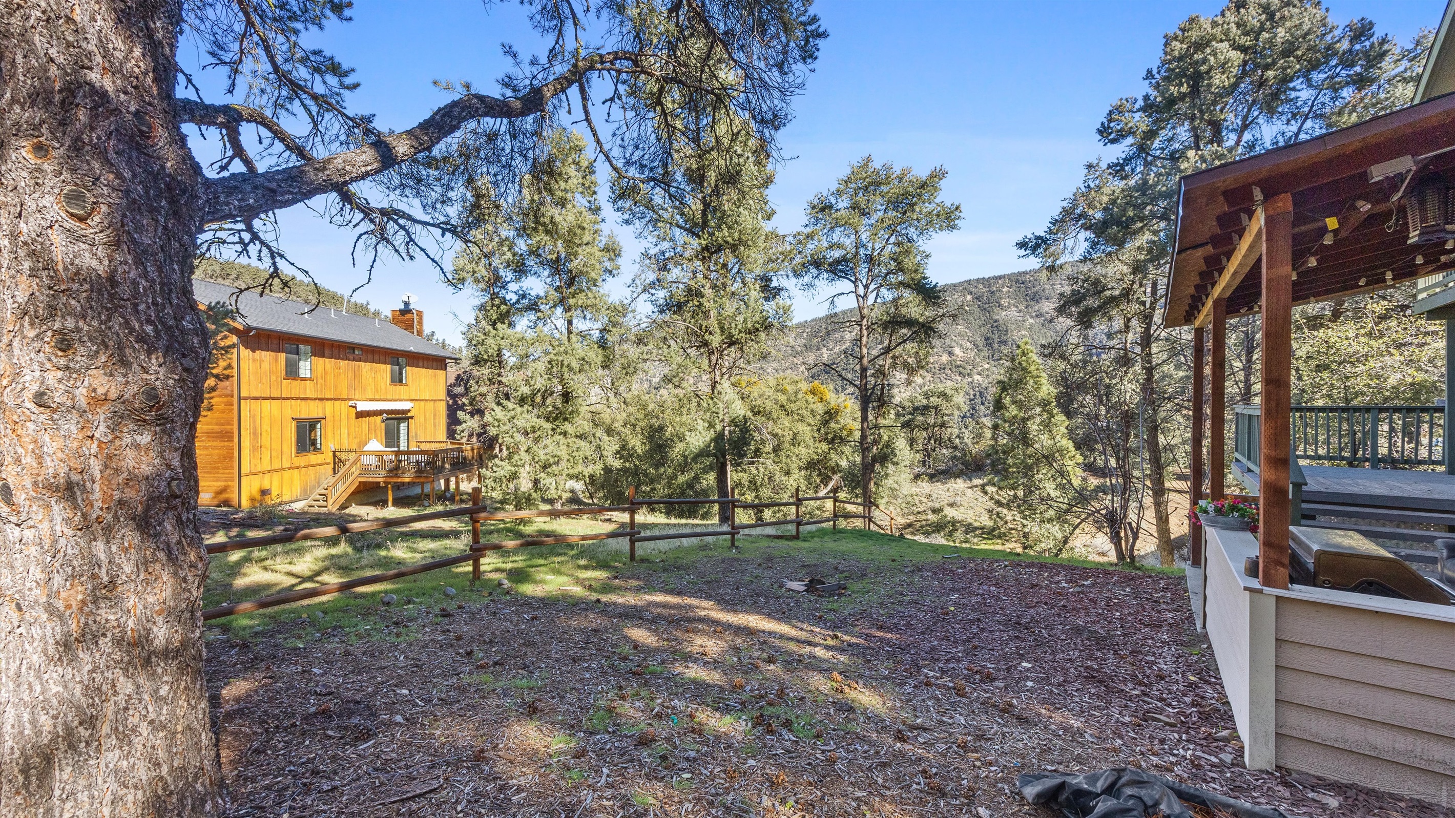 Serene back patio, surrounded by peaceful nature and fresh mountain air.