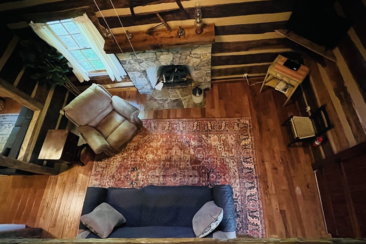 Looking down at the living room from the sleeping loft