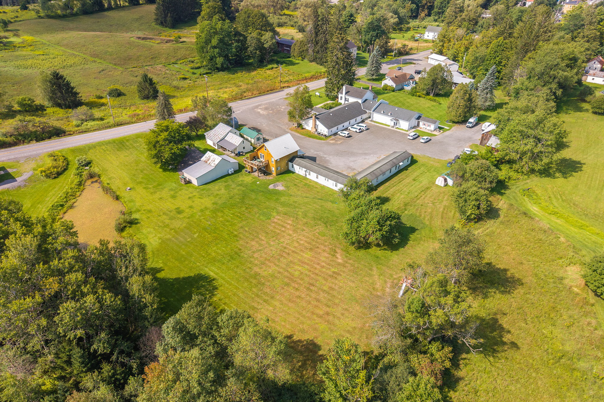 The 1825 rentals sit amid spacious lawns and a scenic country landscape.