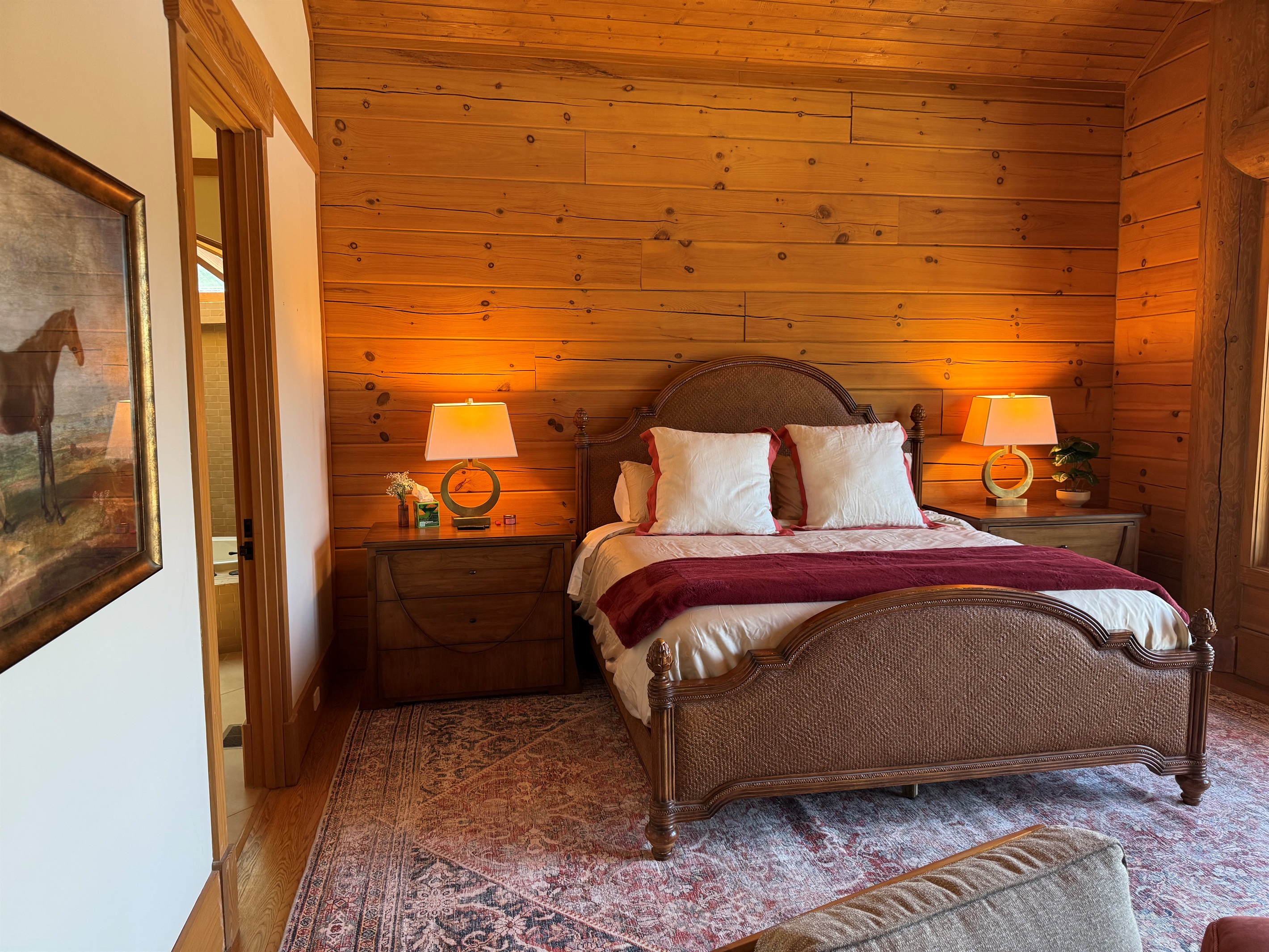 Spacious master bedroom featuring a comfortable king bed and a cozy propane fireplace