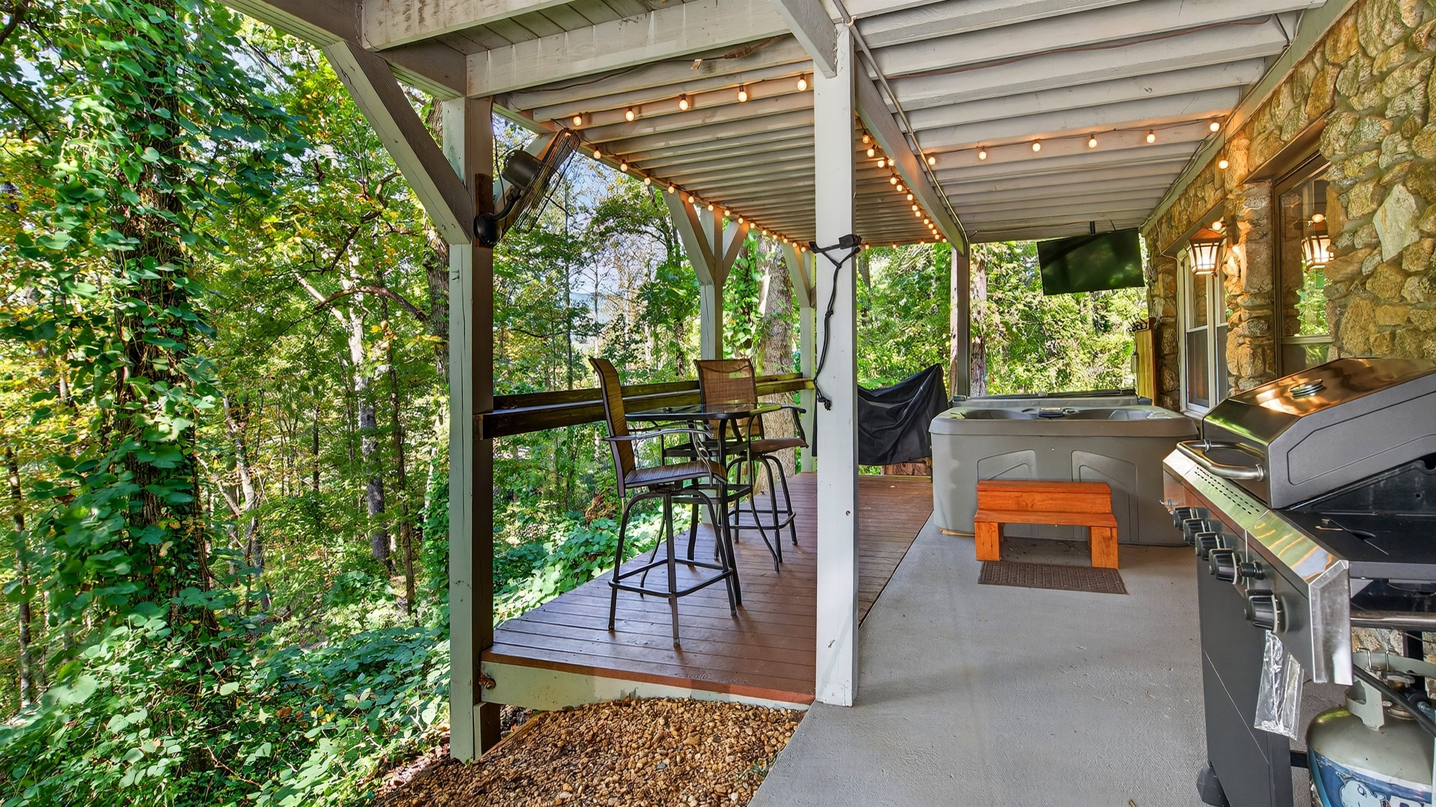 Enjoy a movie from the hot tub, with an outdoor TV.