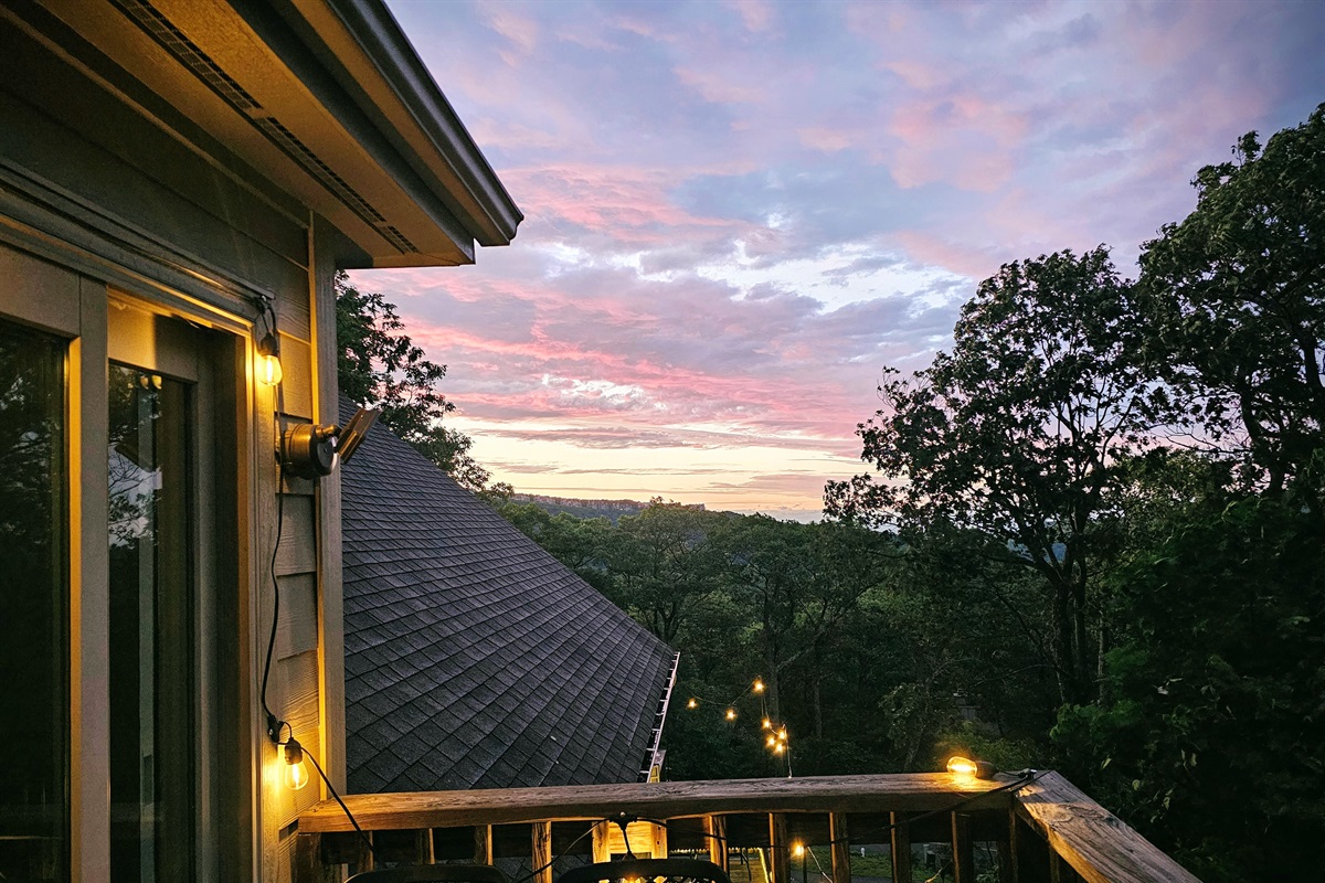 Sunset magic from the Vista Balcony—watch the sky ignite as string lights glow and the mountain quiet settles in. A favorite spot for wine or wonder
