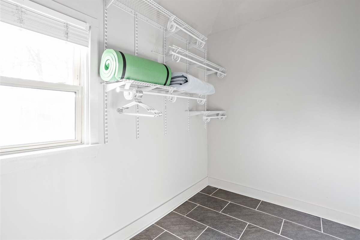 Store your belongings and clothes in the expansive primary bedroom closet.