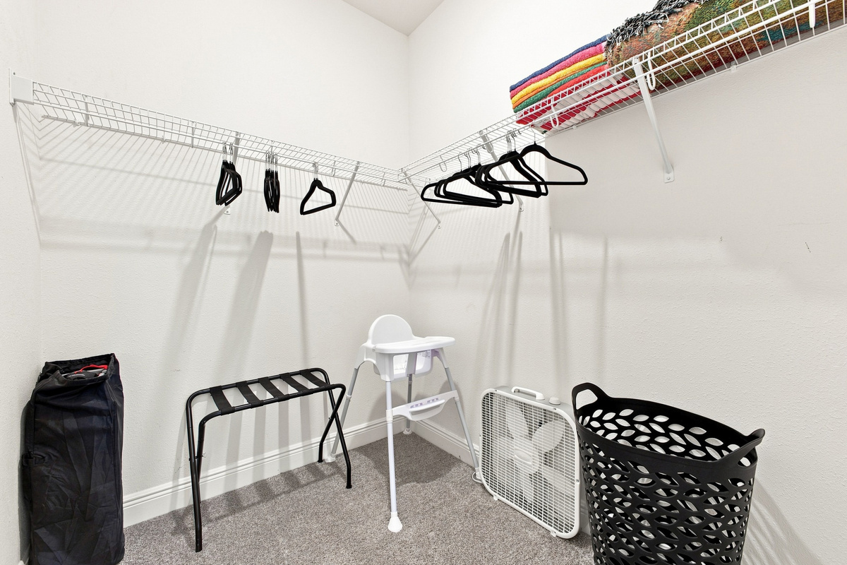 Large Master Closet Complete With Baby Items, Towels, Extra Blanket, and Fan