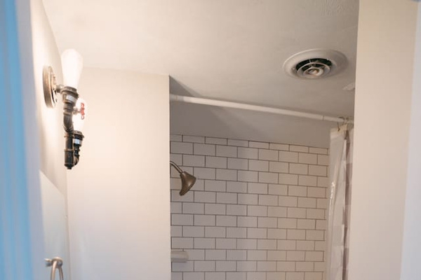 Full Bathroom, bathtub, mirror & sink & a toilet. Simple, clean, and comfortable for a refreshing start to your day.