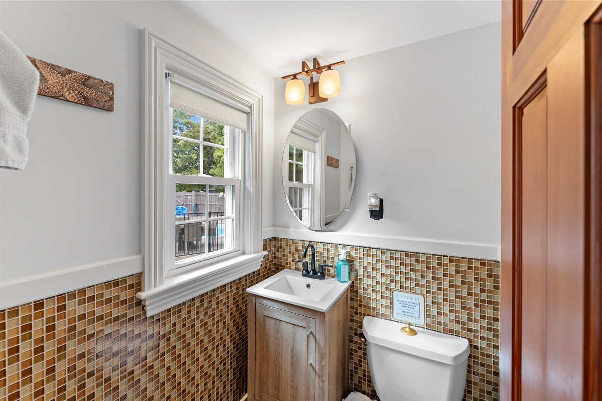 A stylish, intimate ensuite half bathroom, perfect for your personal use.