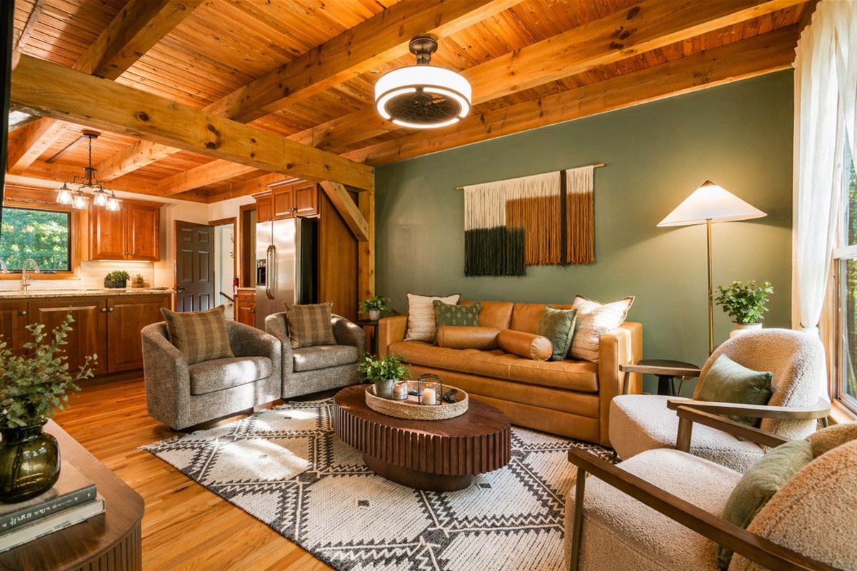 Settle into the leather sofa, put something on the TV, and let the rest of the group wander in — the living room pulls everyone back together eventually.