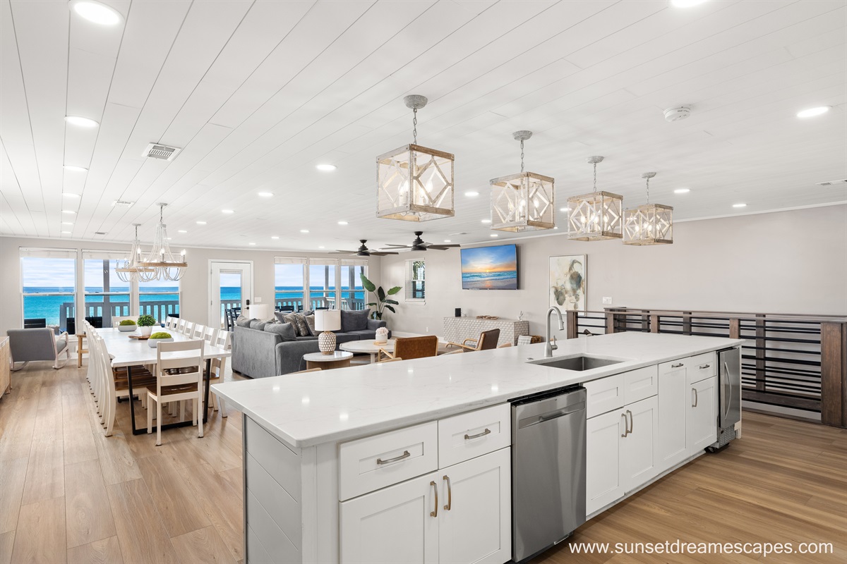 Enjoy unmatched views of the Emerald Coast from your fully renovated and well-appointed keeping room. Comfort abounds in spaces for cooking, eating, relaxing, or entertaining. Outdoor dining area  tables are just out the beachside door!