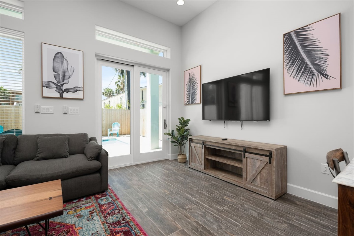 Living room with door access to the pool