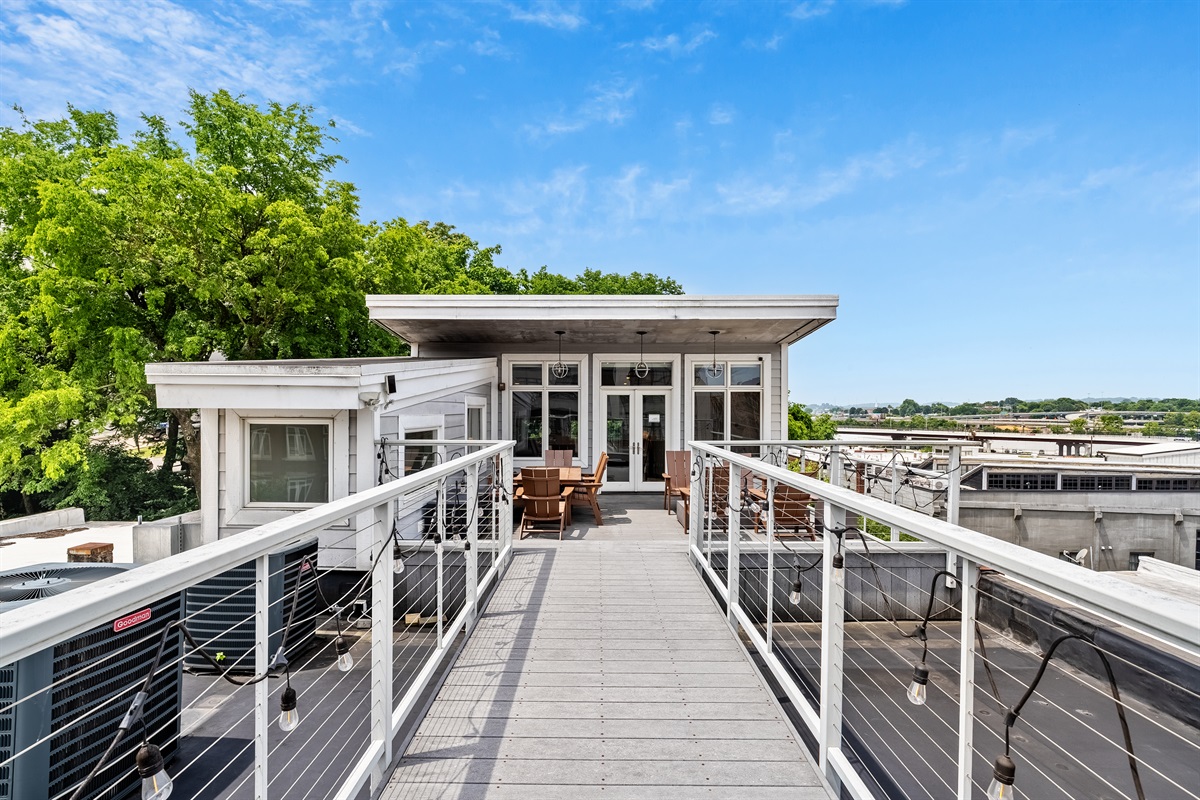 Spacious rooftop perfect for lounging or dining.
